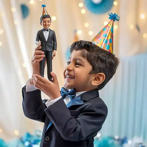Child holding a birthday gift miniature replica
